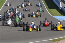 Formula Vee - a large fields of cars head for the first turn.